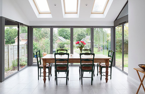 inside view of a house extension with grey Visofold 1000 bifold doors